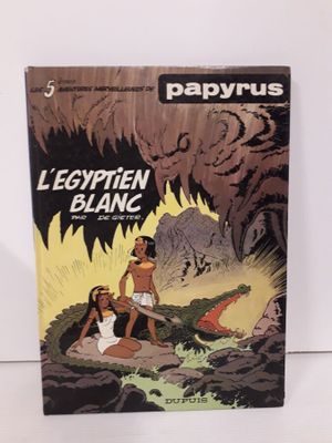 la couverture d'une bande dessinée représentant un homme et une femme dans une grotte