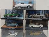 five different models of cars in a display case