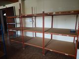many shelves that are on the wall in the room