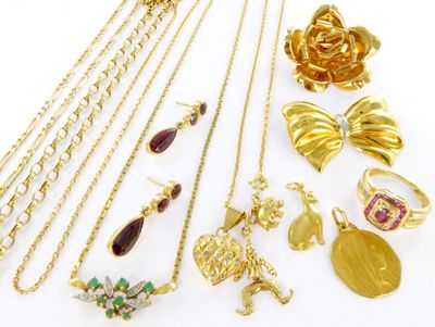 various gold and silver jewelry including rings, necklaces, earrings, and rings