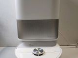 an image of a white air purifier sitting on top of a table