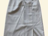a white skirt with a zipper on the front and side