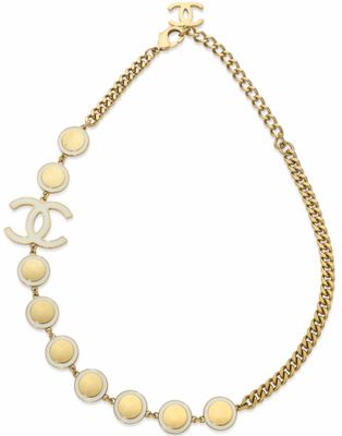 a chanel necklace with a gold chain and a chanel logo