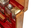 a wooden box with silverware in it on a white surface