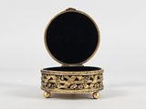 an image of a gold box with a black lid on a white background