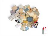 a pile of old papers and other papers on a white surface