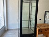 an image of a kitchen with a refrigerator and a table