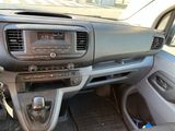 a dashboard of a car with a radio and a steering wheel