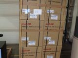 many boxes stacked on top of each other in a garage