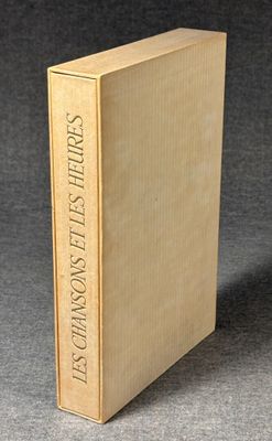 an old book sitting on top of a table next to a black background