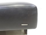 a close up of a black leather arm rest on a chair