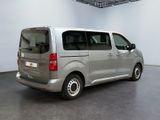 a silver van that is parked in a room