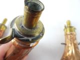 a person holding a brass object in their hand