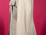 an image of a woman ' s jacket on a mannequin stand