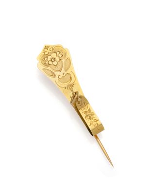 an image of a gold tie bar on a white background