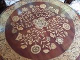 a wooden table with a floral design on it