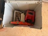 a box with tools in it sitting on the floor