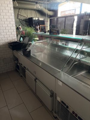 an image of a restaurant kitchen with a counter and a counter top