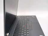 a laptop computer that is open on a white surface