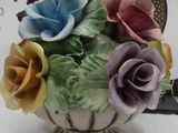 a vase with flowers in it on a table