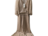 a dress hanging on a hanger on a white background