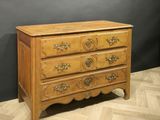 an antique chest of drawers on a wooden floor in a room