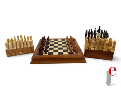 a lot of chess pieces that are sitting on a table