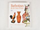 a book with a picture of vases and birds on it