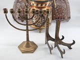 a metal candelab with a candle holder on it
