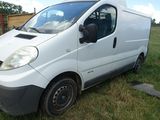 a white van that is parked in the grass