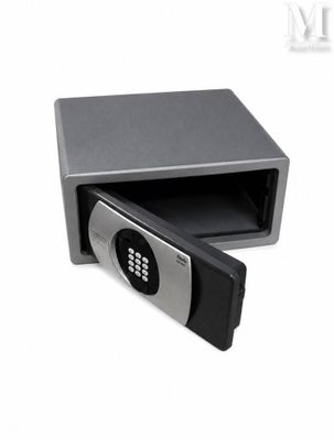 a small electronic safe box with a key lock on it