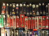 a lot of spoons and spoon spoons that are on display