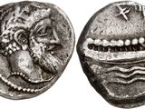a silver coin with an image of a man and a woman on it