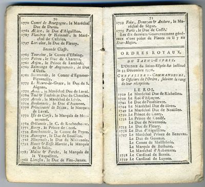 an open book with a bunch of writing on it sitting on a table