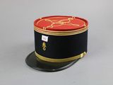 a black hat with a red and gold design on it