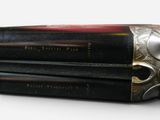 two books sitting on top of each other on a table
