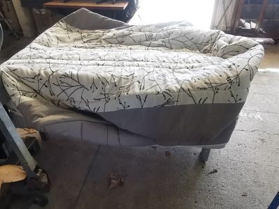 a bed that is sitting in the middle of a room