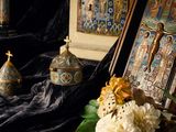 a picture of a table with flowers and a picture of a crucifix
