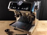 a coffee machine that is sitting on a wooden table