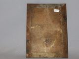 an old book sitting on a table with a tag on it
