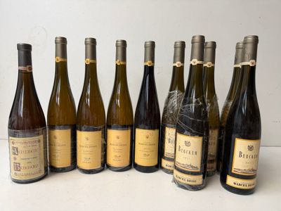 several bottles of wine are lined up in a row on a table