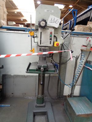a machine that is sitting in a room with a red and white tape around it