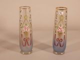 two vases that have been decorated with flowers on them