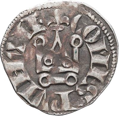a silver coin with an image of a man ' s face on it