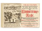 un vieux livre sur lequel figure le dessin d'un village et de personnages