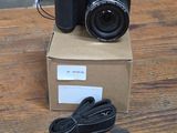 a camera sitting on top of a box on a table