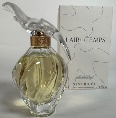 un flacon de parfum surmonté d'un oiseau
