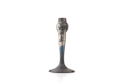 a black vase with a blue and white design on it