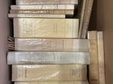 a lot of books in a box on the floor