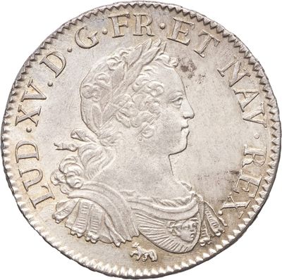 une pièce en argent avec l'image d'une femme de profil